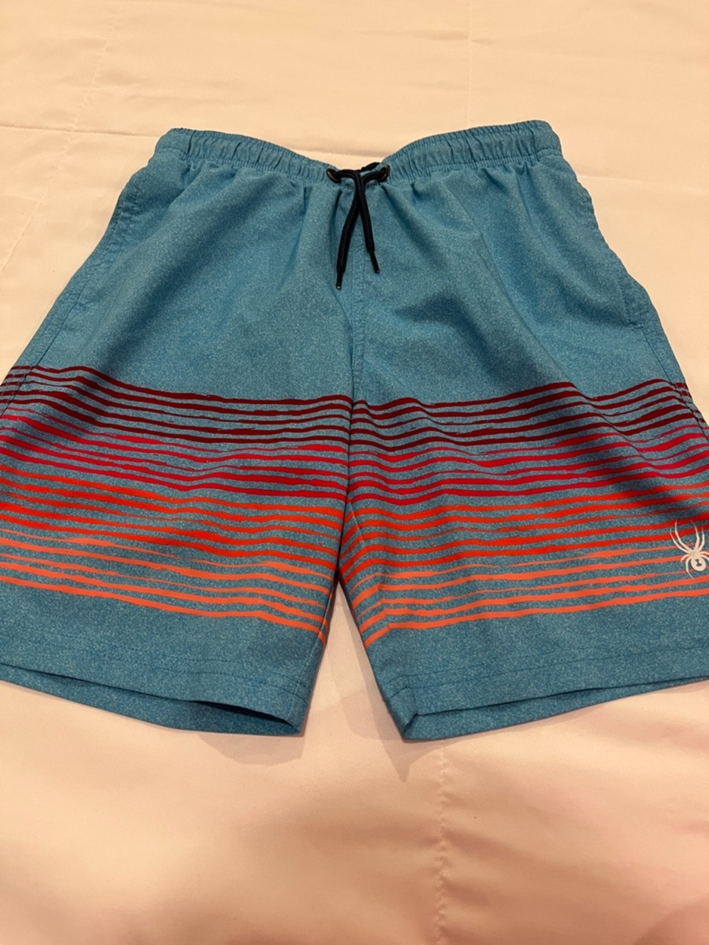 Spyder Teal Swim Trunks with Red and Orange Stripe Accents